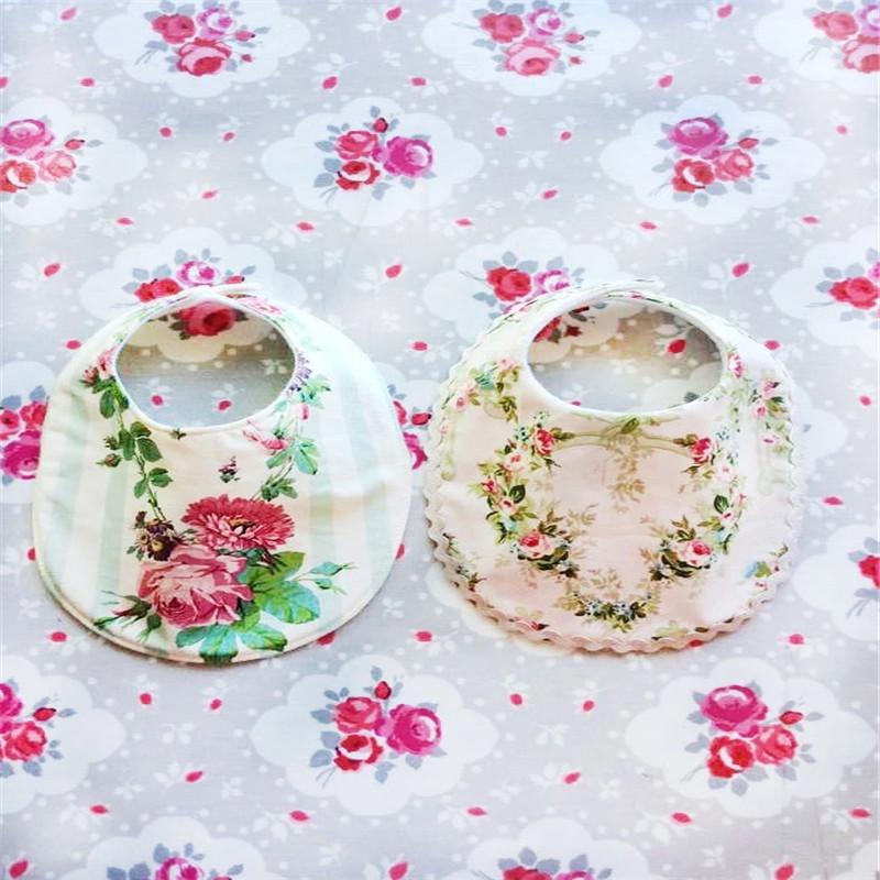These beautiful dribble bibs by Little Bird Designs have a double snap closure for adjustable fastener